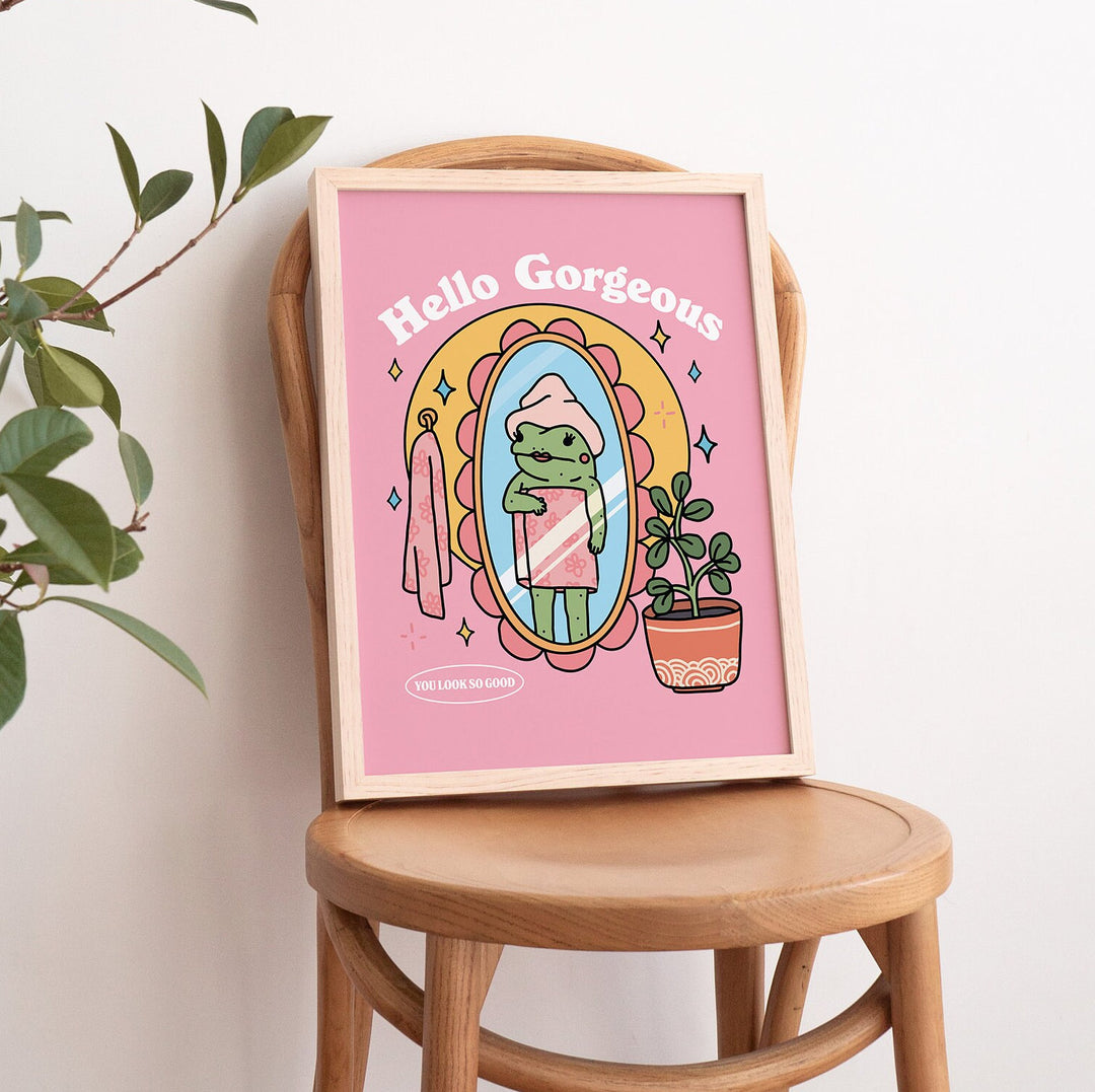 Close-up of pink frog illustration on premium paper with bold typography