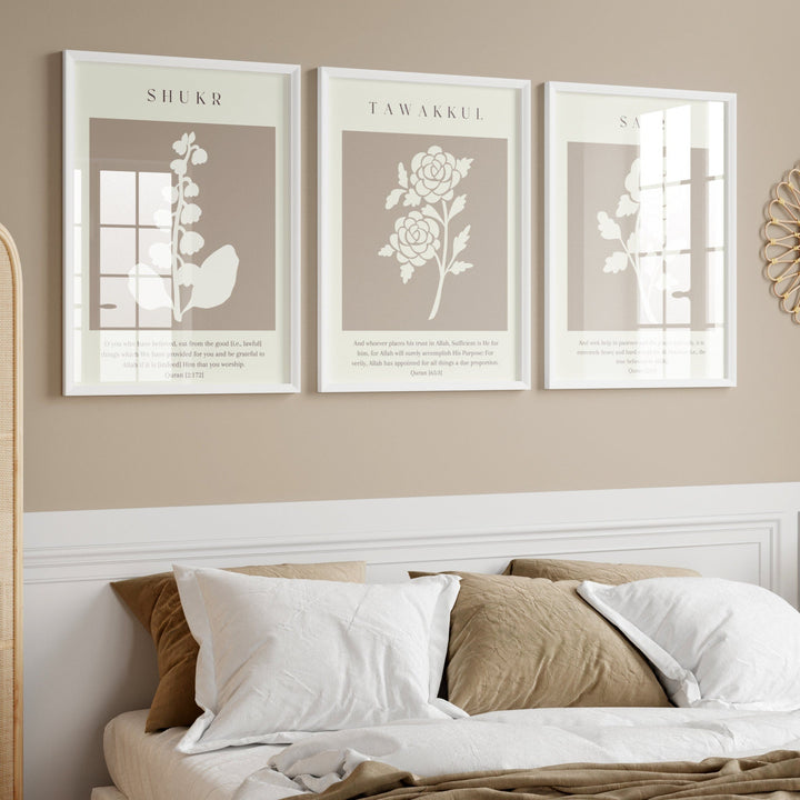 Decorative wall art above a bed with a lamp and mirror on a beige wall.
