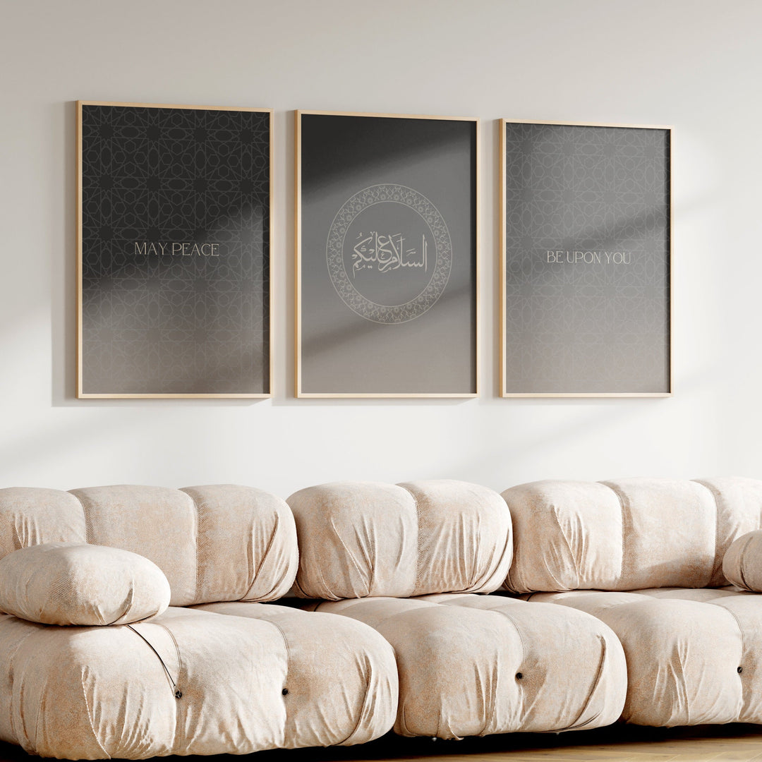 Three framed prints on a wall above a beige sofa