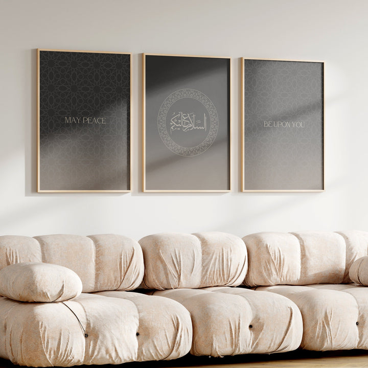 Three framed prints on a wall above a beige sofa