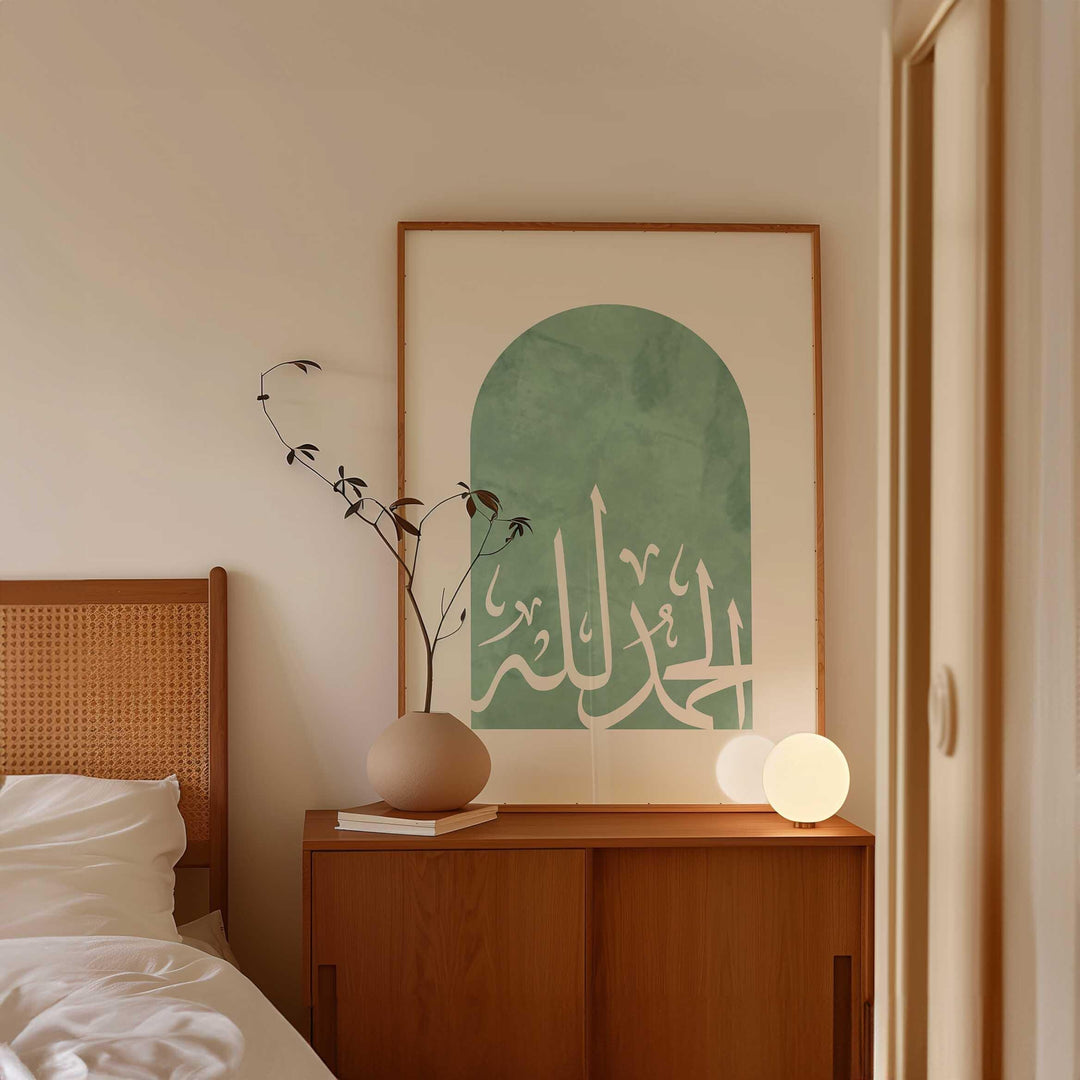 Close-up of Arabic calligraphy on green Islamic wall print