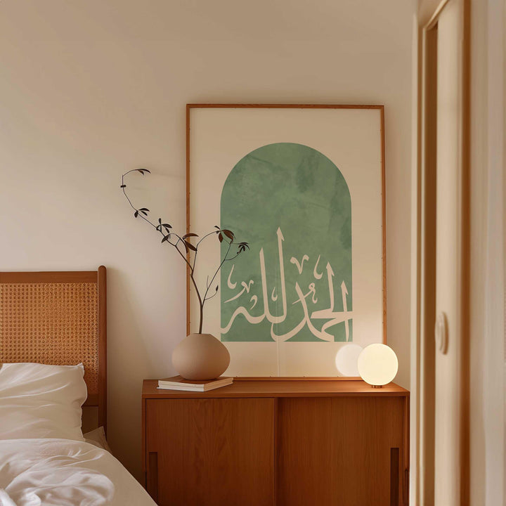 Close-up of Arabic calligraphy on green Islamic wall print