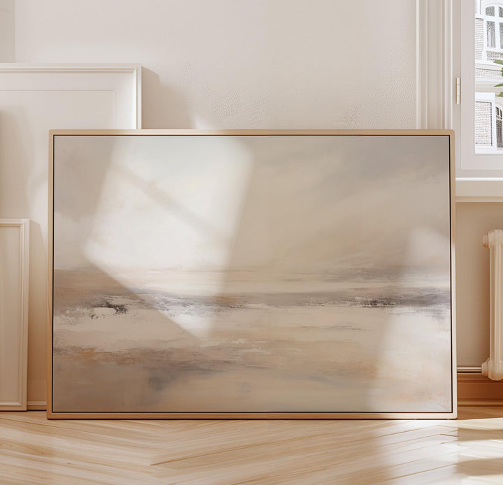 Minimalist coastal wall art in beige and grey, styled above a sofa for modern decor