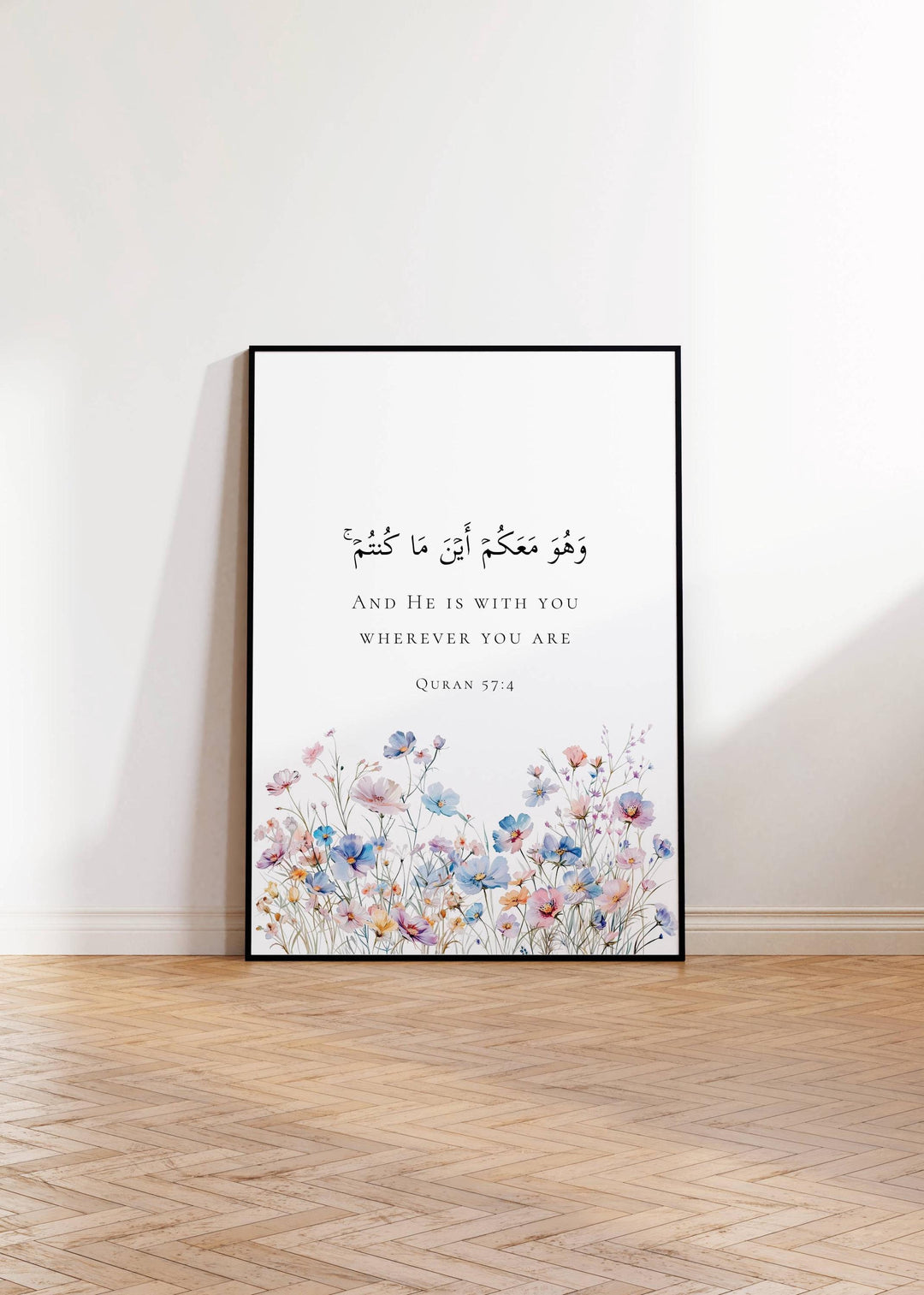 Close-up of Quran 57:4 typography with delicate floral accents