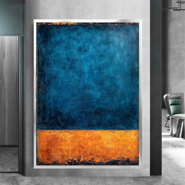 Close-up view of blue and orange brushwork on canvas