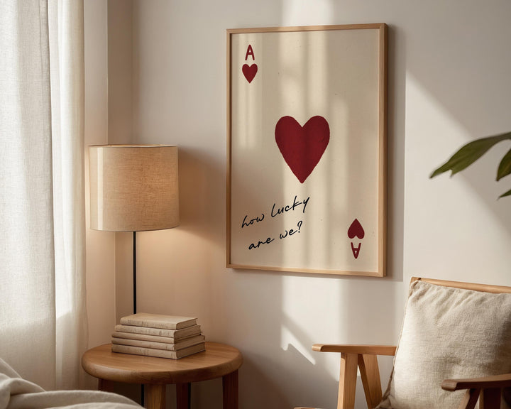 Styled bedroom scene with the playing card wall art above a bed