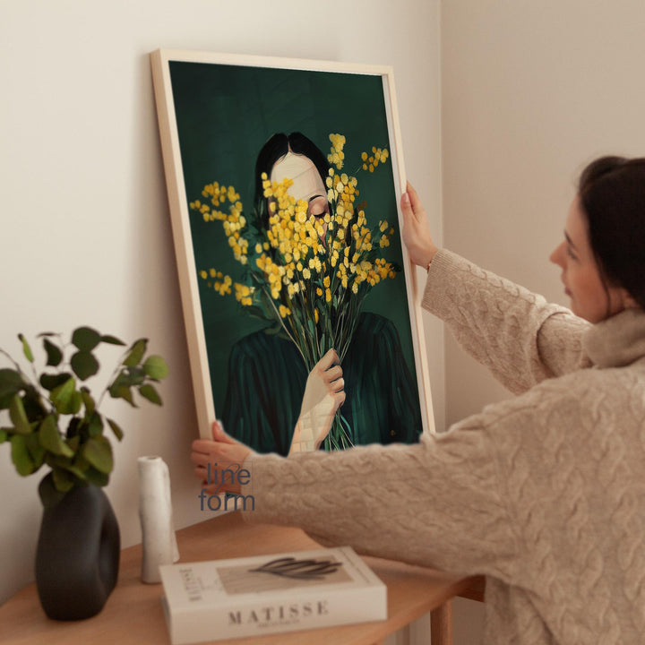 Framable wall art of a modern minimalist woman with mimosa flowers