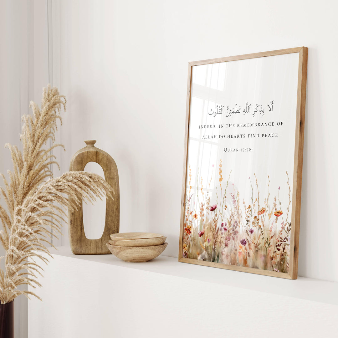 Front view of wall art displaying Quran 13:28 in script
