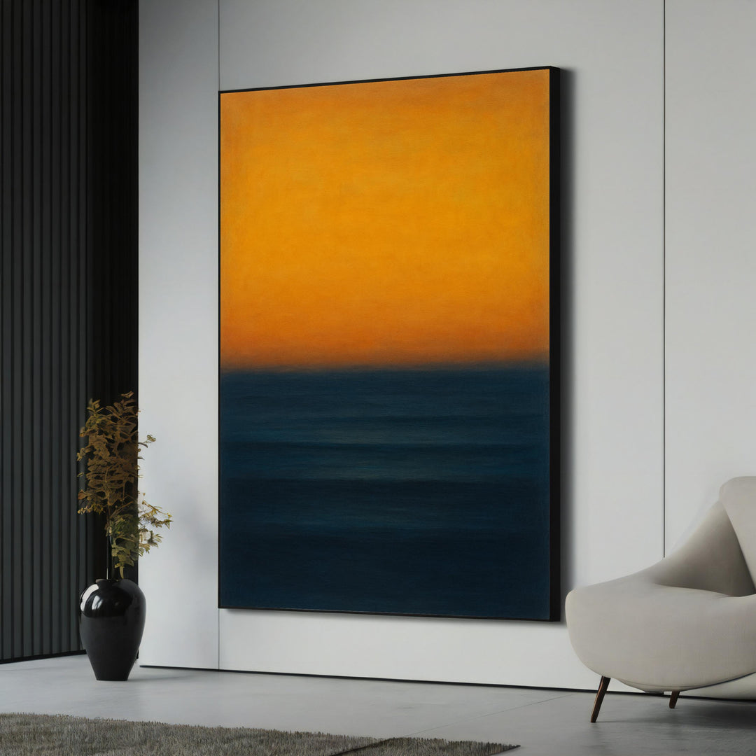 Abstract canvas art with yellow and navy sunset tones on wall