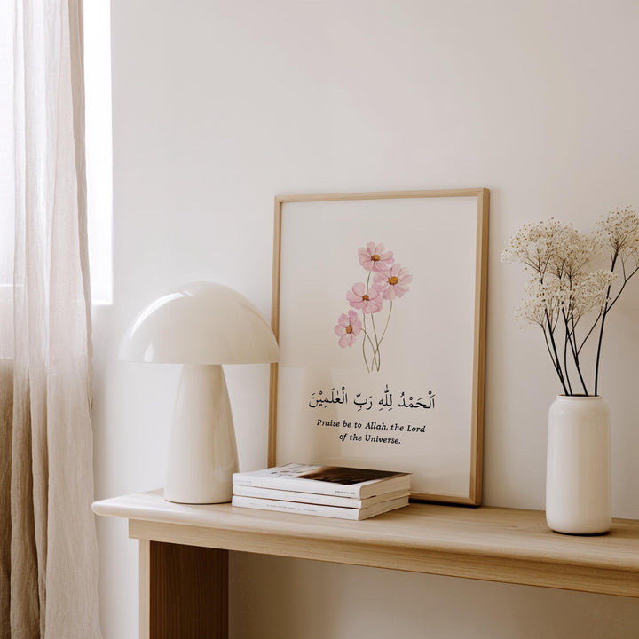 close up of pink islamic wall decor with dhikr script