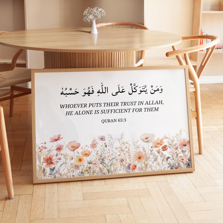 Quran 65:3 verse wall art shown in a soft pastel floral setting