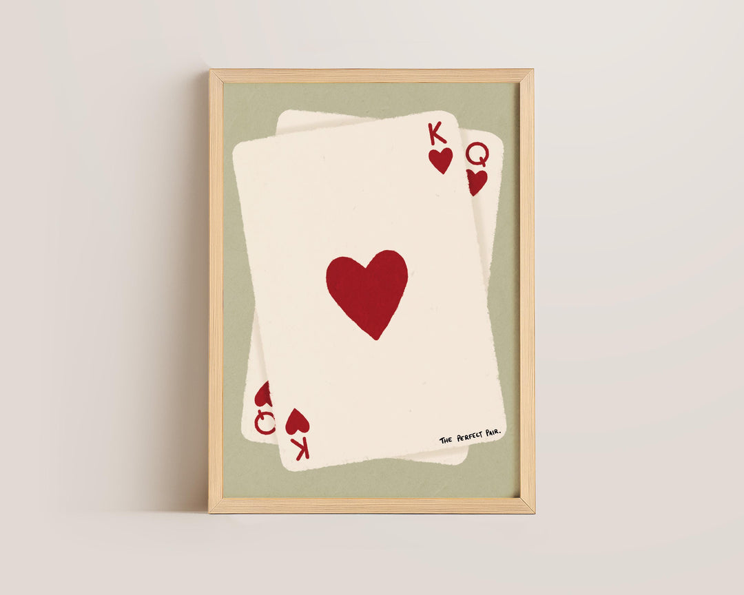 Warm-toned bedroom wall art featuring hearts and card design