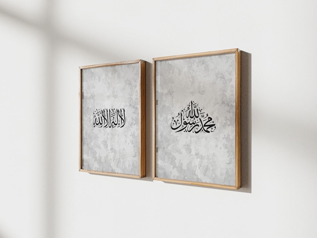 Close-up of bold Arabic script on white canvas with subtle texture