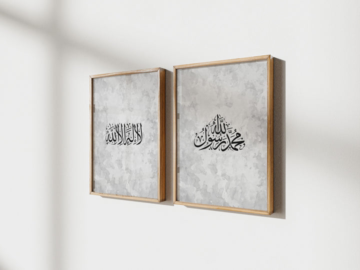 Close-up of bold Arabic script on white canvas with subtle texture