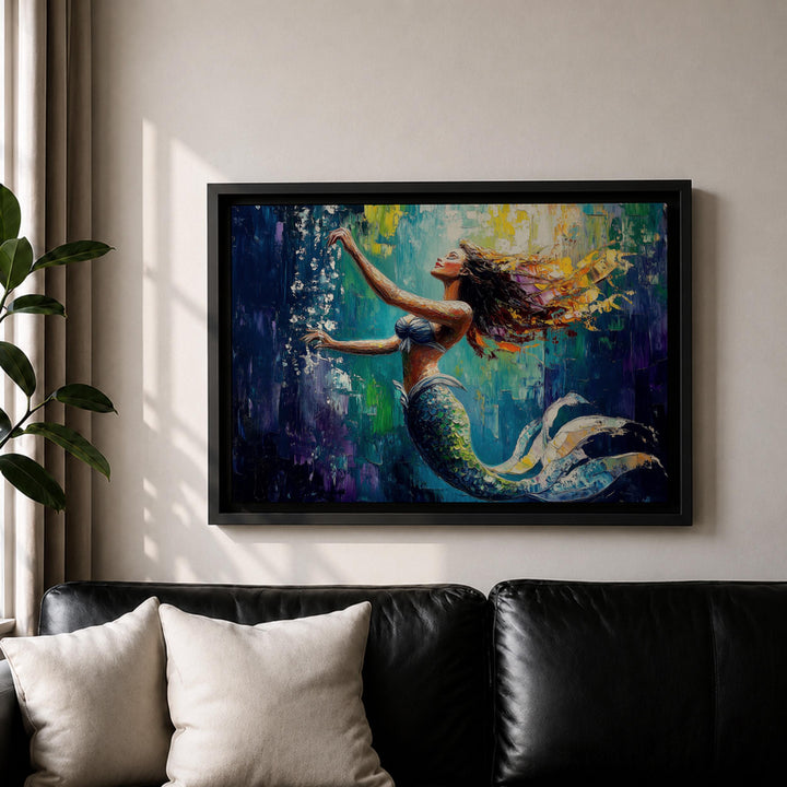 Coastal decor mermaid wall art in a black frame with deep ocean hues