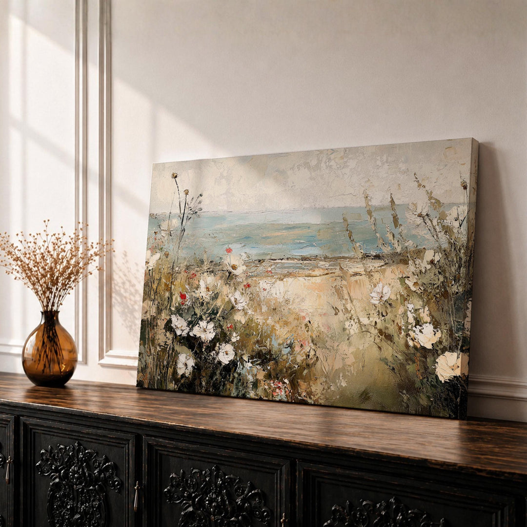 Framed coastal floral wall art on canvas with beach flowers in soft seaside tones