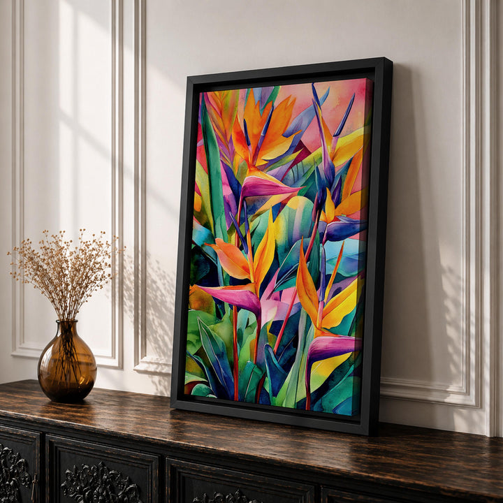 Framed tropical floral artwork viewed from an angled perspective showing the wooden frame