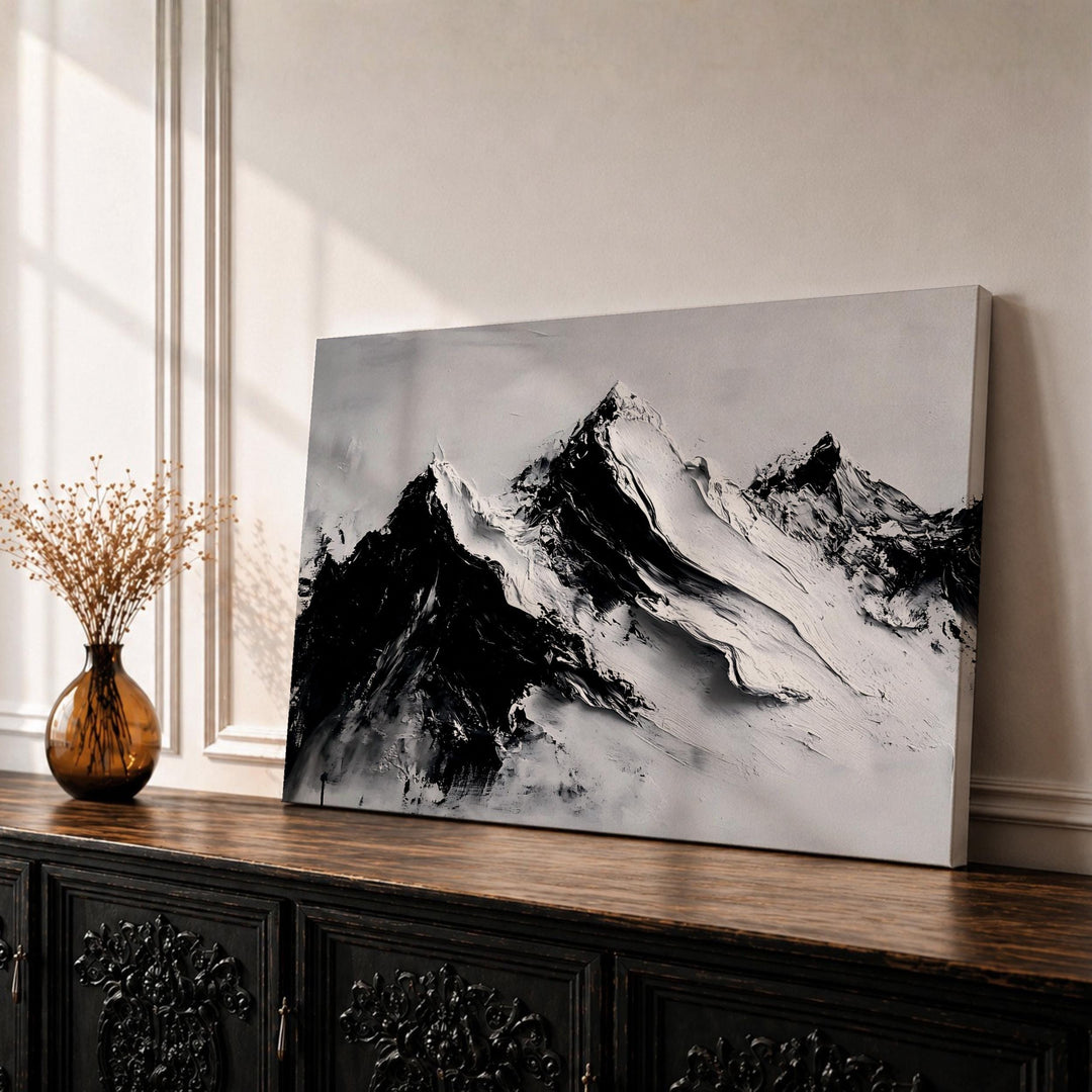 Framed mountain wall art featuring alpine peaks in a minimalist landscape