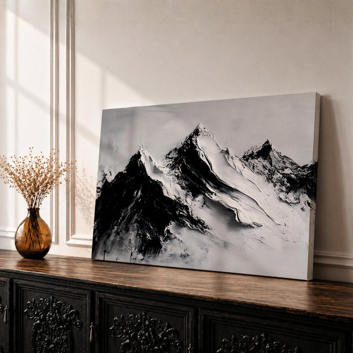 Framed mountain wall art featuring alpine peaks in a minimalist landscape